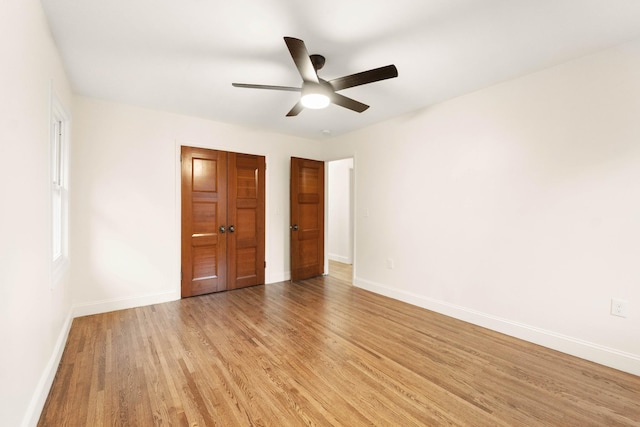 unfurnished bedroom featuring a closet, ceiling fan, and light hardwood / wood-style flooring