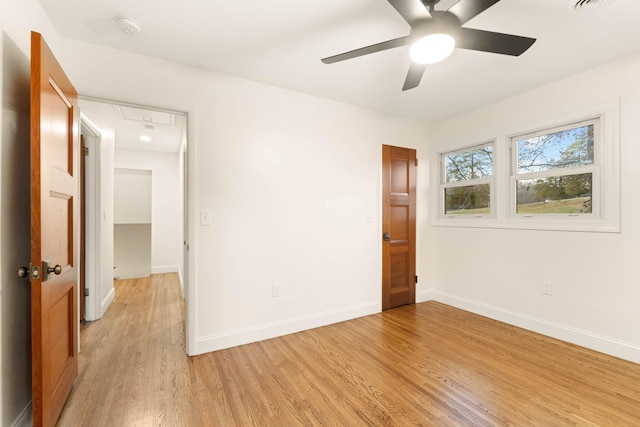 unfurnished room featuring light wood-type flooring and ceiling fan