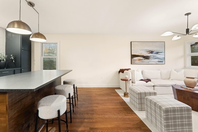 interior space featuring dark hardwood / wood-style flooring and an inviting chandelier