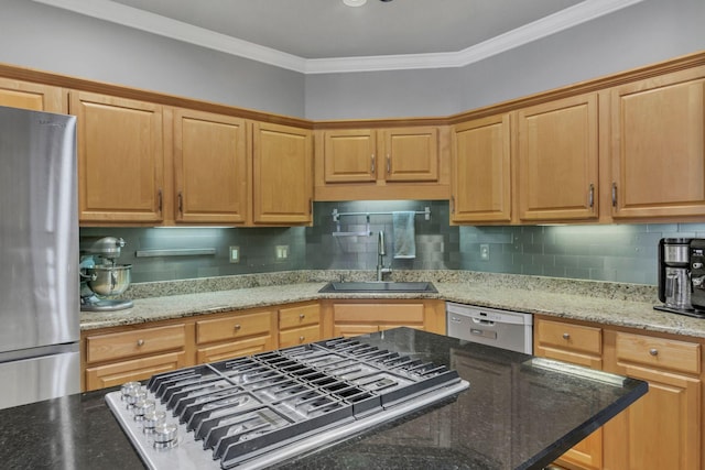 kitchen with light stone countertops, sink, crown molding, and appliances with stainless steel finishes