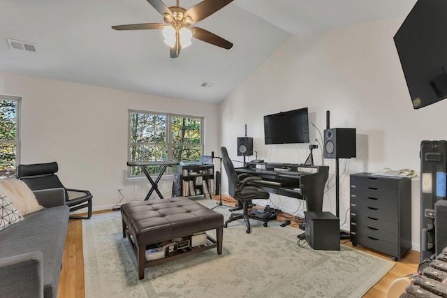 office with ceiling fan, light wood-type flooring, and vaulted ceiling