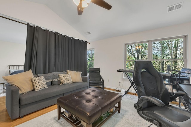 office space with hardwood / wood-style flooring, vaulted ceiling, a wealth of natural light, and ceiling fan