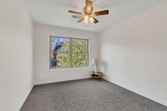 carpeted empty room featuring ceiling fan