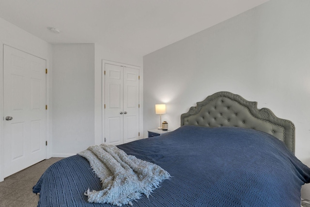 carpeted bedroom with a closet