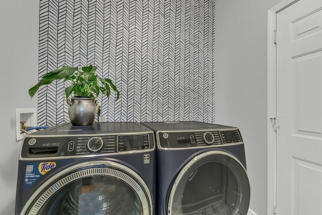 washroom with washer and clothes dryer