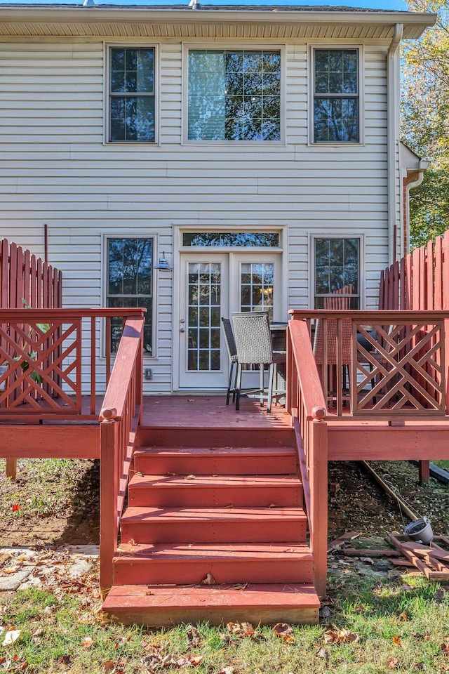 back of property with a deck