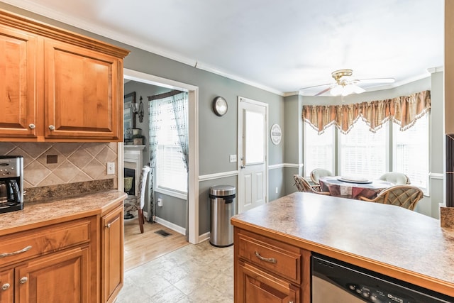 kitchen featuring backsplash, ceiling fan, crown molding, dishwasher, and light hardwood / wood-style floors