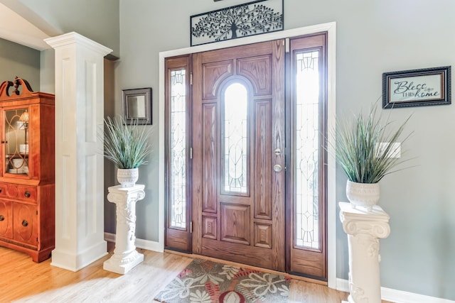 foyer entrance with light hardwood / wood-style floors