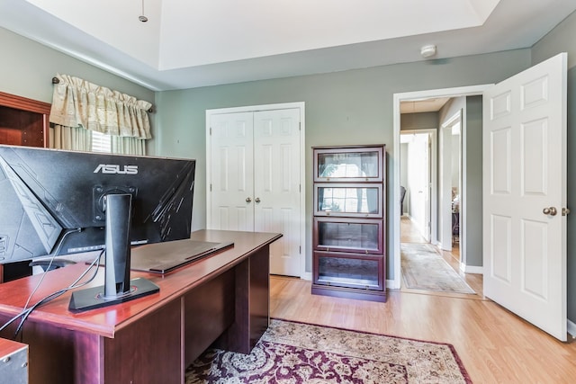 office area with light hardwood / wood-style floors