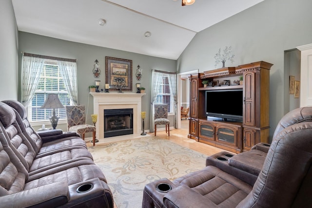 living room featuring light hardwood / wood-style floors and lofted ceiling