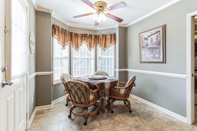 dining room featuring ceiling fan and ornamental molding