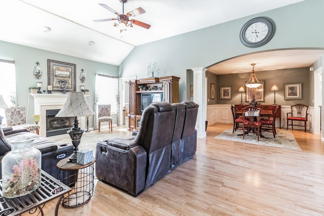 living room with a wealth of natural light and light hardwood / wood-style flooring