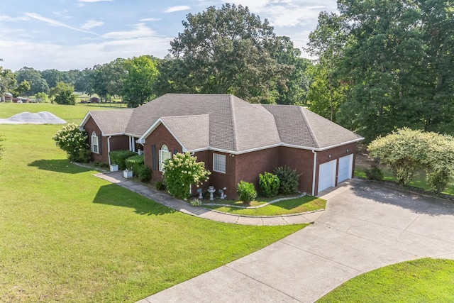 view of front of property featuring a front yard and a garage