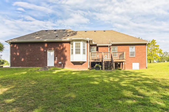 back of house with a yard and a wooden deck