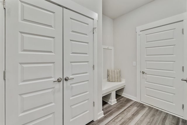 mudroom with hardwood / wood-style floors