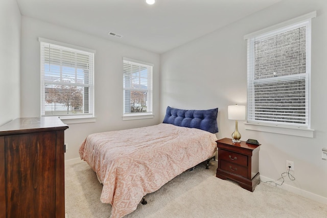 bedroom with light carpet