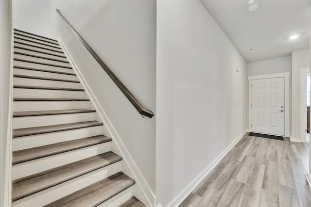 staircase featuring hardwood / wood-style flooring