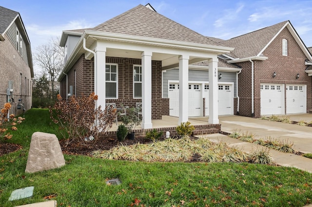 view of front of house with a porch and a garage