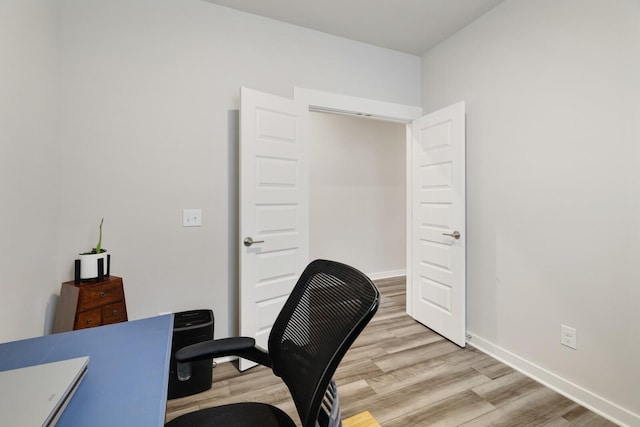 office with light wood-type flooring