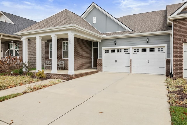 view of front of property featuring a garage and covered porch