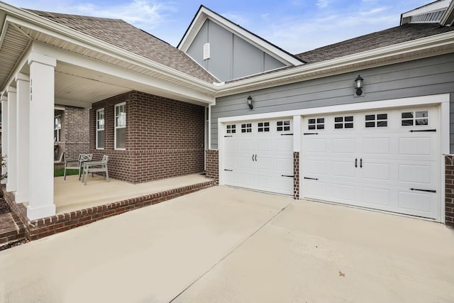 view of property exterior featuring covered porch and a garage