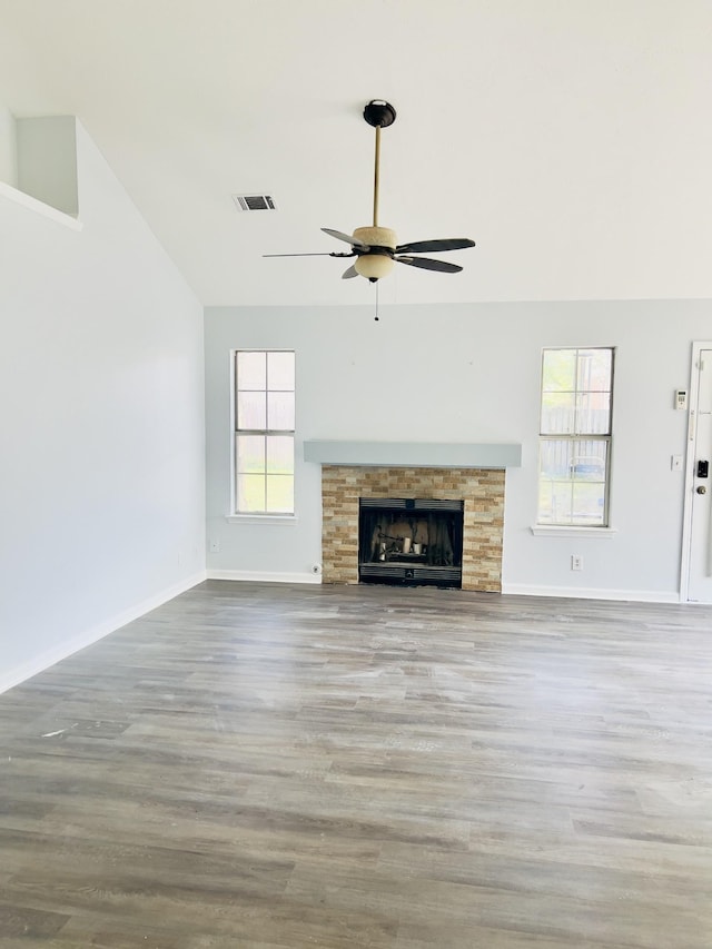 unfurnished living room with light wood-type flooring and plenty of natural light