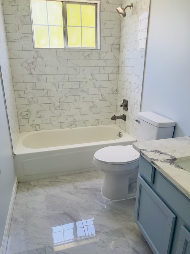 full bathroom with vanity, tiled shower / bath combo, and toilet