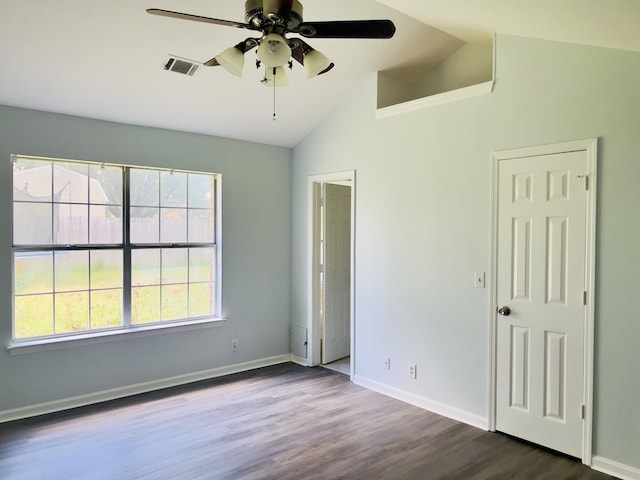 unfurnished bedroom with ceiling fan, dark hardwood / wood-style flooring, and lofted ceiling