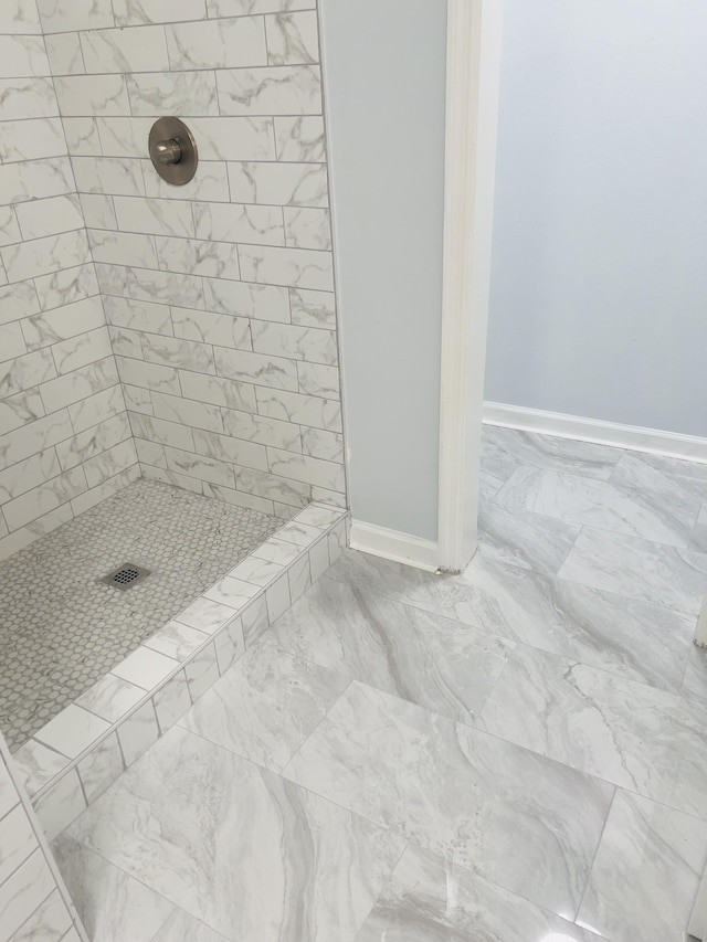 bathroom with tiled shower