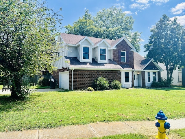 view of front of home with a garage and a front lawn