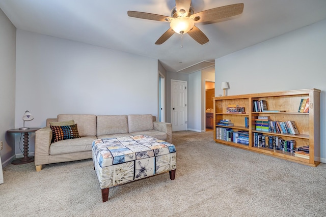 carpeted living room with ceiling fan