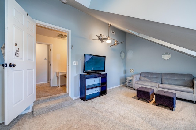 carpeted living room with ceiling fan