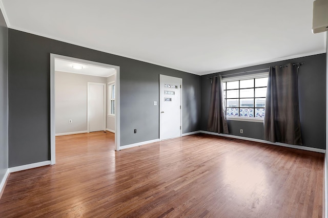 unfurnished room featuring hardwood / wood-style flooring