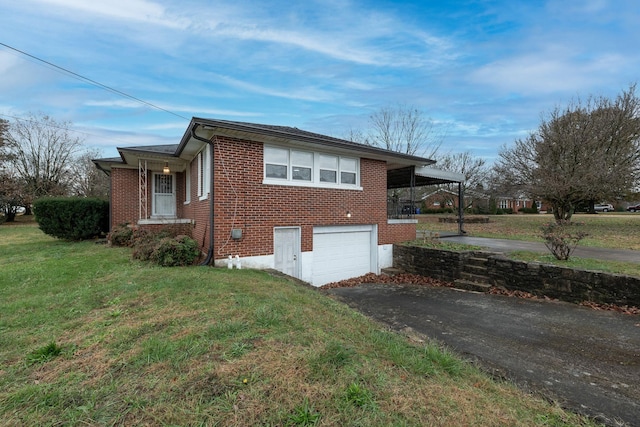 view of side of property featuring a yard and a garage