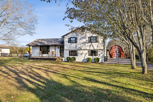 view of front facade featuring a front lawn and an outdoor structure