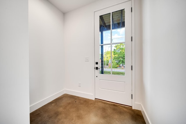 doorway with dark colored carpet