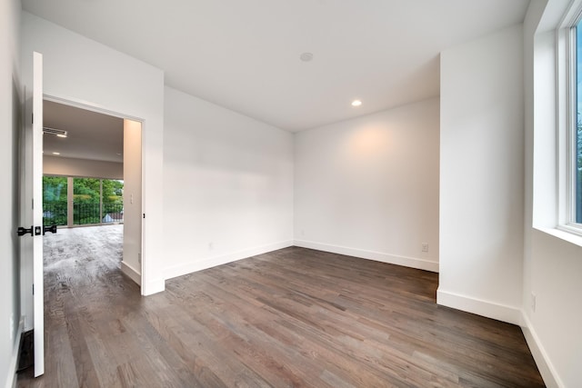 spare room featuring dark hardwood / wood-style flooring