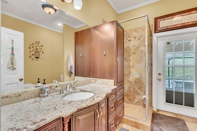 bathroom featuring tile patterned flooring, vanity, an enclosed shower, and crown molding