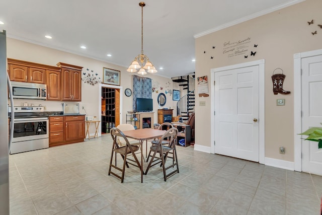 dining area featuring light tile patterned flooring, crown molding, and a chandelier