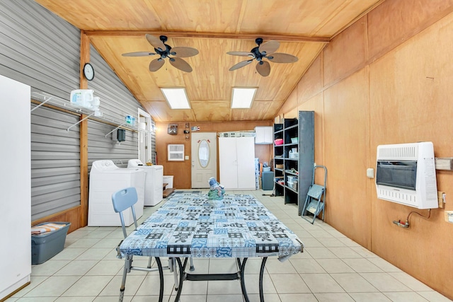 interior space with heating unit, ceiling fan, and washer and clothes dryer