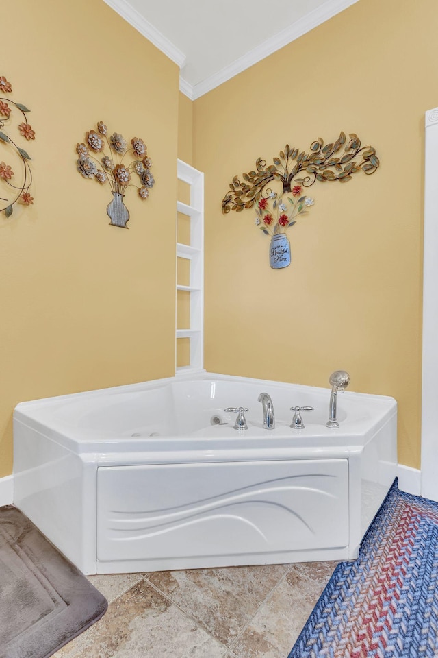 bathroom with ornamental molding and a tub to relax in