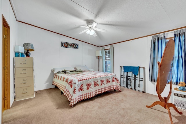 bedroom featuring ceiling fan, light carpet, and a textured ceiling