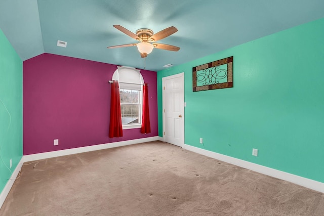 unfurnished room with carpet, ceiling fan, and lofted ceiling