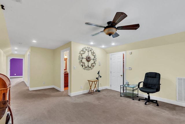 living area with ceiling fan and light colored carpet