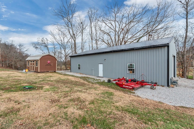 view of outbuilding featuring a yard