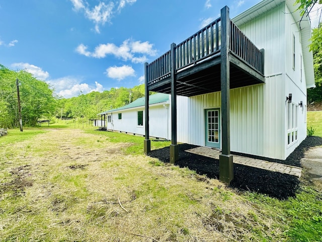 view of side of property with a lawn