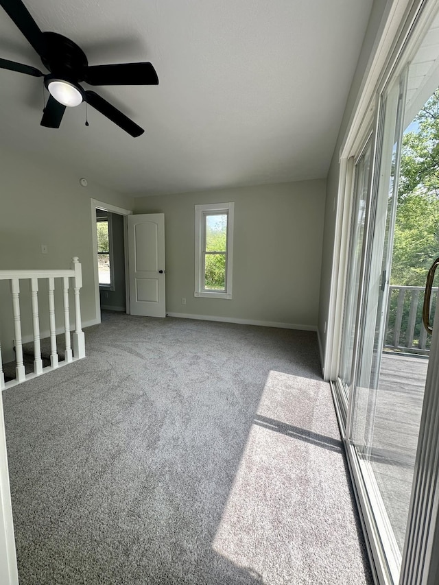 empty room featuring carpet and ceiling fan