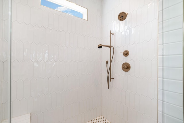 bathroom with tiled shower