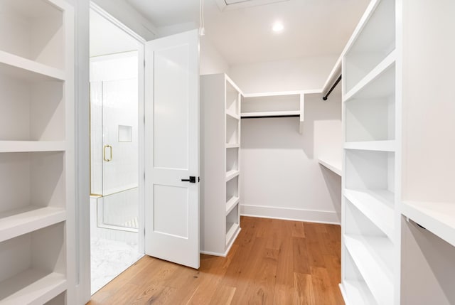 walk in closet featuring light hardwood / wood-style floors