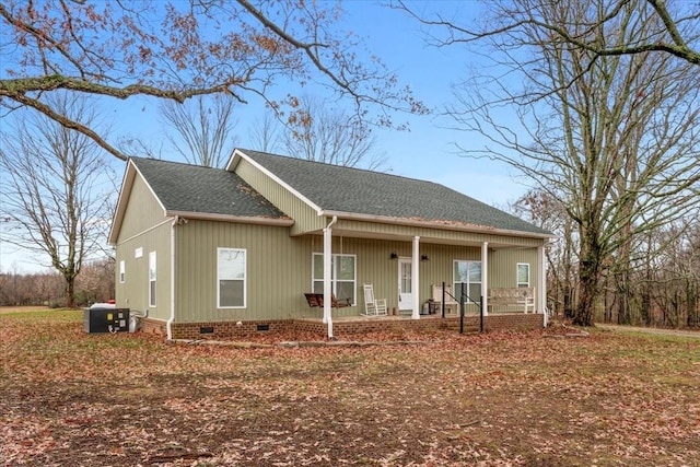 view of front facade with covered porch and central AC unit